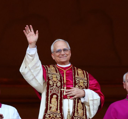 Pope Leo XIV (Robert Francis Prevost) addresses the crowd from the balcony of St. Peter's Basilica, delivering his first message as the first American pope.