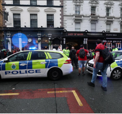 Ambulance and paramedics at Liverpool parade scene after vehicle hits fans