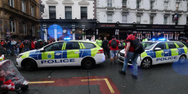 Ambulance and paramedics at Liverpool parade scene after vehicle hits fans