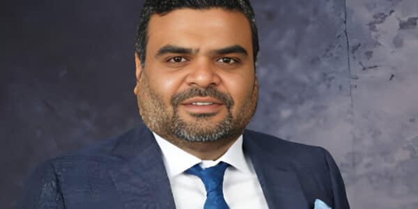 Portrait of Anil Jain associated with Refex Industries and its business expansion.